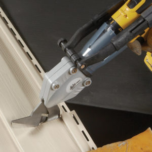 Malco's TSV1 TurboShear being used to cut a long piece of vinyl Siding